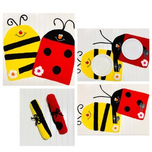 May include: Crocheted placemats featuring a bee, ladybug, and butterfly design. The placemats are yellow, red, and black with white accents.