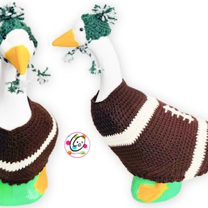 May include: Two decorative goose figures, one facing forward and the other sideways. Both are wearing a brown and white football-themed sweater and a green and white knit hat with a pom-pom. The goose's feet are green and yellow.
