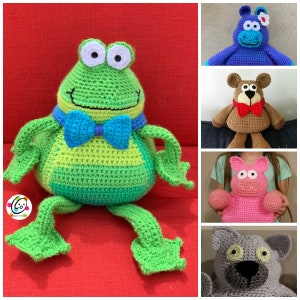 May include: A collection of five crocheted stuffed toys: a green frog with a blue bow tie, a blue hippopotamus with a pink flower, a brown bear with a red bow tie, a pink pig with white eyes, and a grey cat with green eyes.