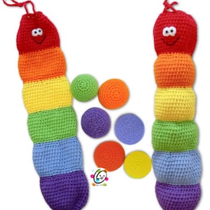May include: Two colorful crocheted caterpillar toys with smiling faces. Each caterpillar has a red head, orange, yellow, green, blue, and purple segments. There are six colorful crocheted balls next to the caterpillars.
