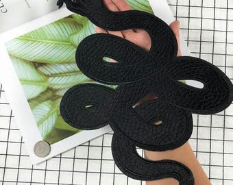 Toppa termoadesiva con motivo serpente nero
