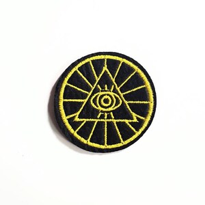 Illuminati ögat triangel broderad stryklapp