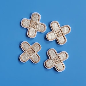 Set van 4 verbandgeborduurde opstrijkpatches