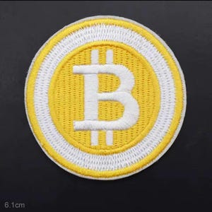 May include: Embroidered patch featuring a Bitcoin symbol. The patch is circular, with a yellow center and a white border. The Bitcoin symbol, a stylized 'B' with vertical lines, is white. The patch measures 6.1 cm in diameter.
