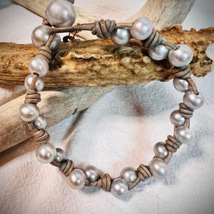 Teal Dyed Cultured Freshwater Pearl Bracelet with Suede Bows Adjustable Length Teal Dyed Cultured Freshwater Pearl Bracelet with Suede Bows Adjustable Length