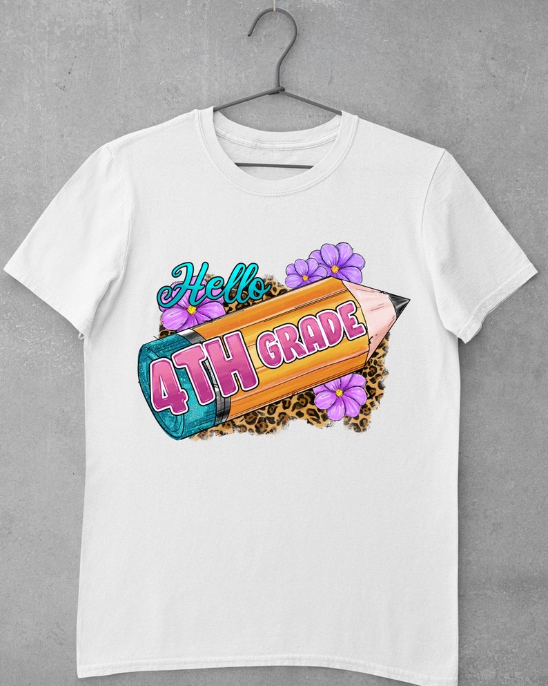 May include: White t-shirt with a graphic of a yellow pencil with the words "Hello 4th Grade" in pink lettering. The pencil is surrounded by purple flowers and a leopard print background.