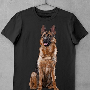 May include: Black t-shirt with a brown and black German Shepherd dog sitting on the front of the shirt.