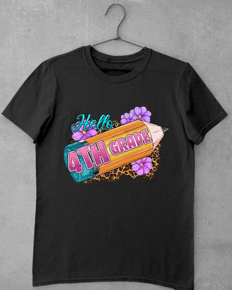 May include: Black t-shirt with a yellow pencil, pink flowers, and the text "Hello 4th Grade" on a leopard print background.