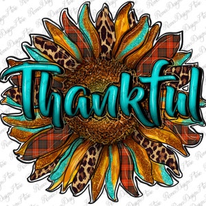 May include: A large sunflower with a plaid and leopard print design. The word "Thankful" is written in turquoise letters across the center of the sunflower.