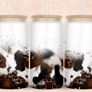 May include: Three white stainless steel tumblers with brown and black leopard print designs and bamboo lids and straws.