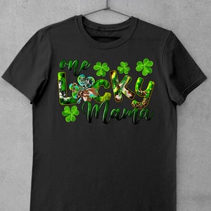 May include: Black t-shirt with the text "one lucky mama" in green and white letters with shamrock designs.