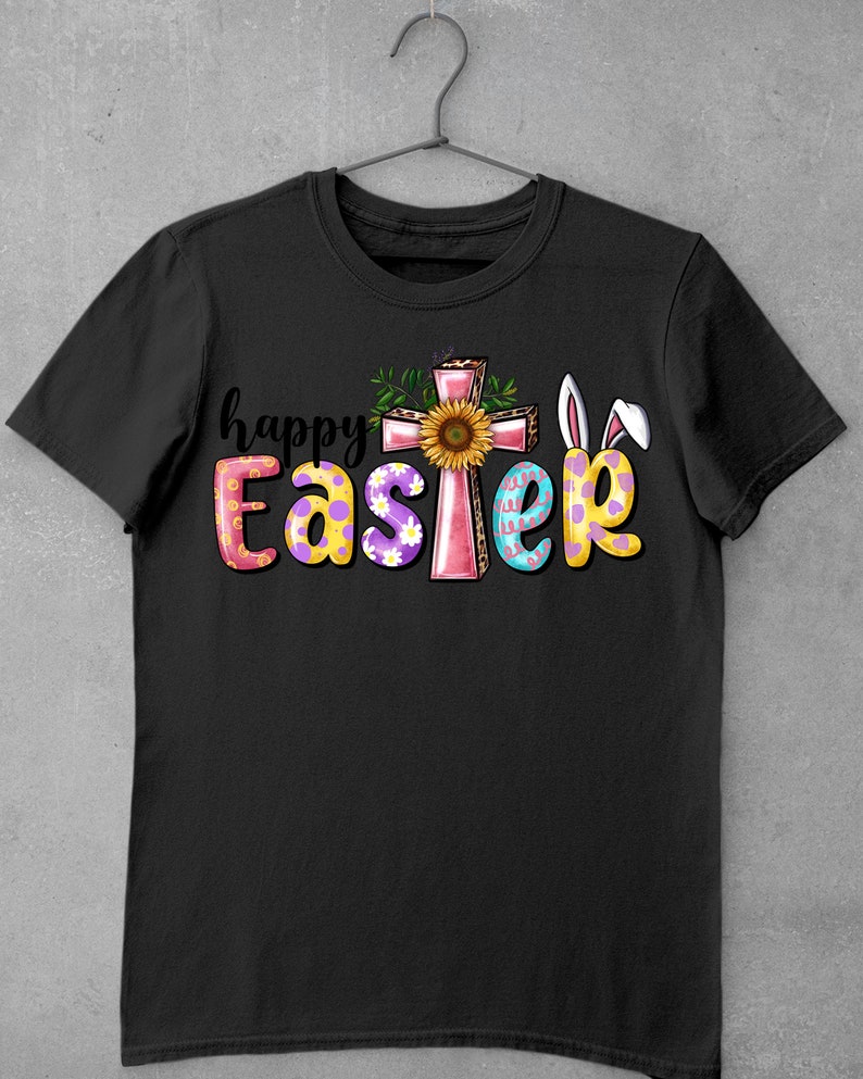 May include: Black t-shirt with a pink cross, a sunflower, and the text "happy Easter" in colorful letters with polka dots and bunny ears.
