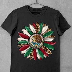 May include: Black t-shirt with a graphic of a sunflower made from the colors of the Mexican flag and leopard print accents.
