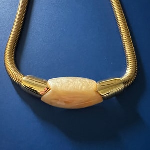 Vintage 1980s Napier choker style gold tone necklace with chunky pendant