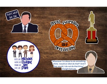 May include: A set of The Office themed stickers featuring characters Michael, Dwight, Jim, and Pam, as well as quotes from the show. The stickers are on a wood background.