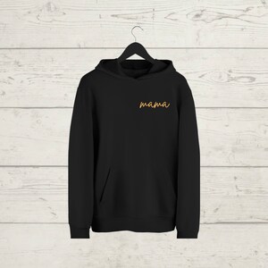 May include: Black hooded sweatshirt with a pocket and the word "mama" embroidered in orange on the front.