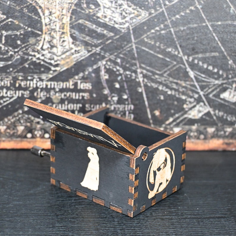 Crafted with intricate details and designed to delight the senses, this music box is a tribute to the classic tale; its tune of Once Upon a December is the perfect way to relive the memories of the beloved characters and their timeless story.