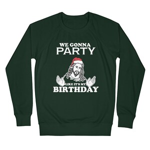 May include: Green long-sleeved sweatshirt with a white graphic of a man wearing a Santa hat and the text "We gonna party like it's my birthday".