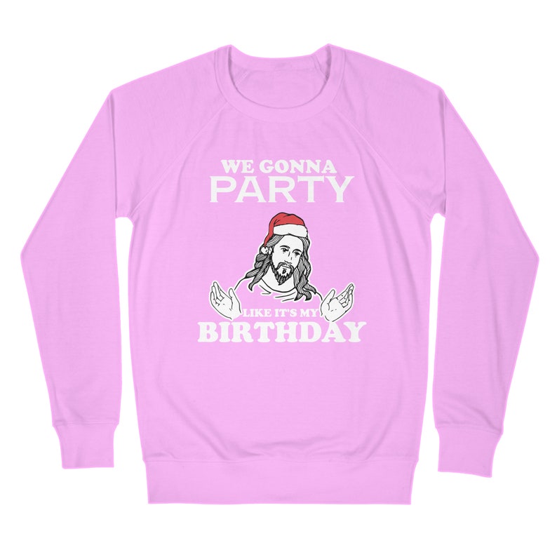 May include: A pink long-sleeved sweatshirt with a white graphic of Jesus wearing a Santa hat and the text "We gonna party like it's my birthday".