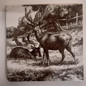 Antique tile of stags and deer by Minton designed by W Wise 1879