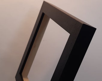 Tile frame six inch wooden and black in colour