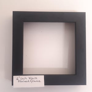 Tile frame  for a 4 inch tile, wood and black in colour