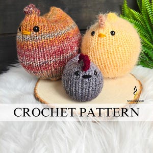 May include: Three crocheted chicken figures in orange, yellow, and gray, with black eyes and red comb details. The chickens are displayed on a wooden slice and white fur. The text "CROCHET PATTERN" is displayed on a white banner.