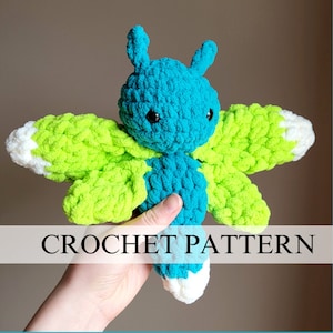 May include: Crochet pattern for a blue and green butterfly amigurumi toy. The toy has white accents on the wings and black eyes.