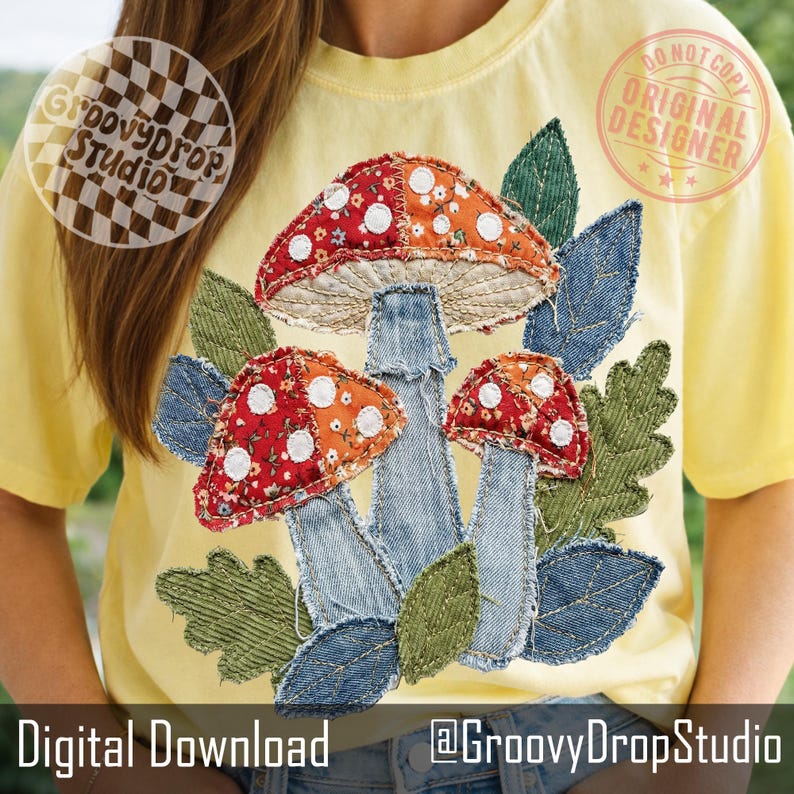 May include: Yellow t-shirt featuring a colorful mushroom design. The mushrooms have red and orange caps with white polka dots, denim stems, and are surrounded by green and denim leaves. The text "Digital Download" and "@GroovyDropStudio" are at the bottom.
