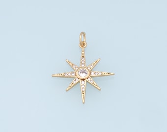 May include: Gold star charm with a clear crystal in the center and smaller crystals around the edges.