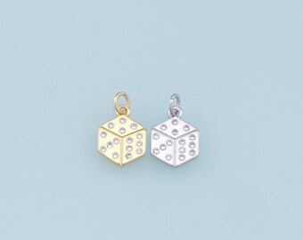 May include: Two dice charms, one gold and one silver, with clear crystal accents. The charms are in the shape of a cube with a raised dot pattern on each side.