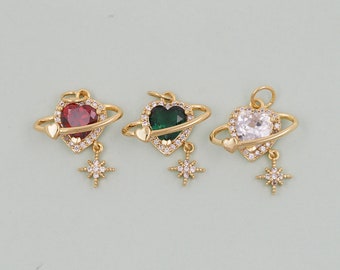 May include: Three gold-tone pendants with a heart-shaped charm surrounded by a ring, each with a different colored gemstone: red, green, and clear. Each pendant has a small star charm dangling below.