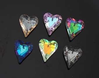 May include: Six heart-shaped crystal pendants in various colours, including clear, purple, green, blue, yellow, and grey. Each pendant has a hole at the top for stringing. The crystals reflect light, creating a rainbow effect.