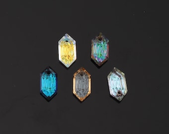 May include: Five faceted crystal pendants in various colors: yellow, teal, iridescent, gray, and blue. Each pendant has a hexagonal shape with a hole at the top for stringing. The crystals are displayed against a dark background.
