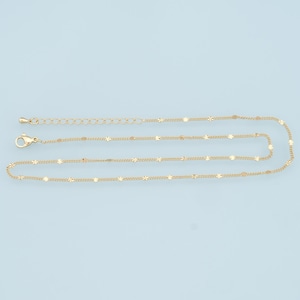 May include: A gold chain necklace with a delicate, dainty design. The chain features small, evenly spaced, star-shaped links.
