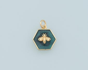 May include: Gold charm with a green enamel hexagon and a gold bee design.