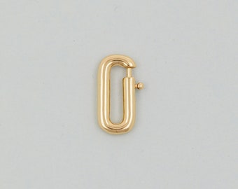 May include: Gold-toned metal clasp with a rectangular shape and a spring-loaded closure.