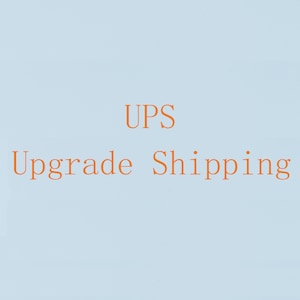 May include: Text that reads "UPS Upgrade Shipping" in orange on a light blue background.
