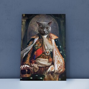 May include: A gray cat wearing a gold and green royal robe with a crown in its paw. The cat is sitting on a throne with a green and gold fabric background.