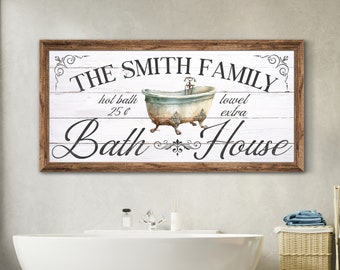May include: A rustic wooden sign with the text "The Smith Family Bath House" in a decorative font. The sign features a vintage bathtub with a tap and a towel hanging on the side. The text "hot bath 25c" and "towel extra" is also included on the sign.