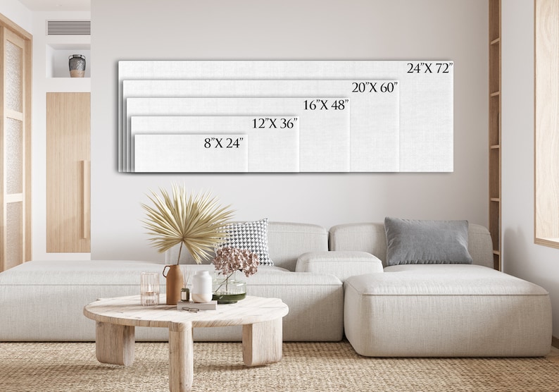 May include: A white canvas print with different size options displayed on a wall above a white sectional sofa. The sizes are 8" x 24", 12" x 36", 16" x 48", 20" x 60", and 24" x 72".