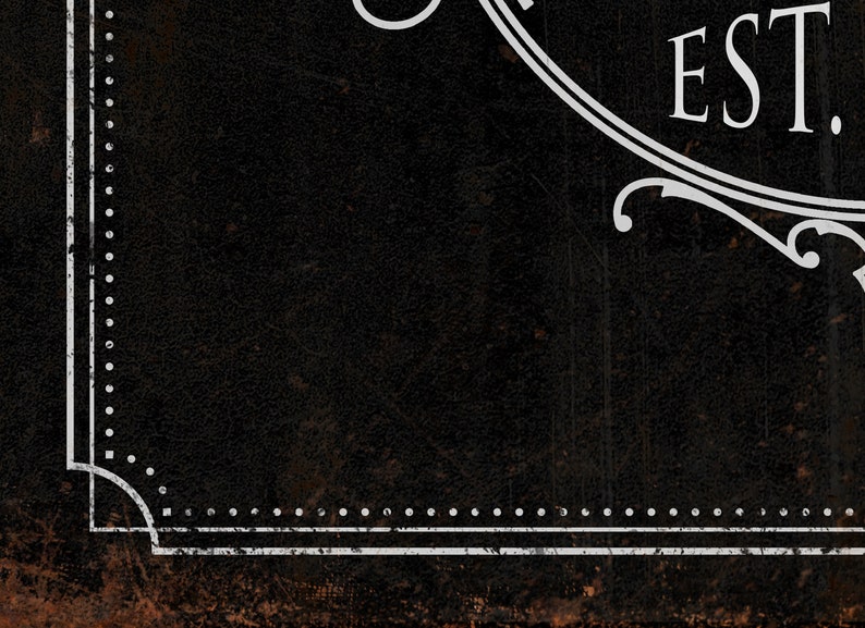 May include: Black background with a white border and the text "EST." in a white circle.