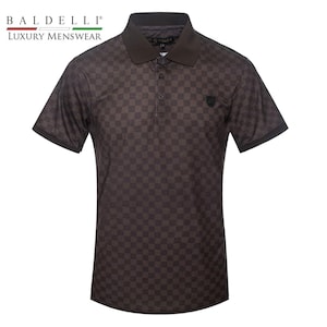 May include: A brown short-sleeved polo shirt with a checkered pattern. The shirt has a black collar and a small black logo on the right chest.