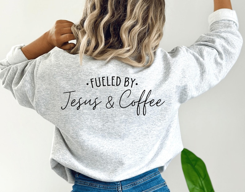 May include: Gray sweatshirt with the text "Fueled by: Jesus & Coffee" printed on the back.
