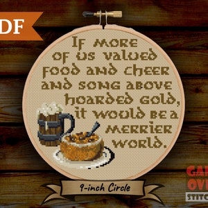 May include: A cross-stitch pattern for a 9-inch embroidery hoop featuring a quote about valuing food, cheer, and song over gold. The quote reads: "If more of us valued food and cheer and song above hoarded gold, it would be a merrier world."