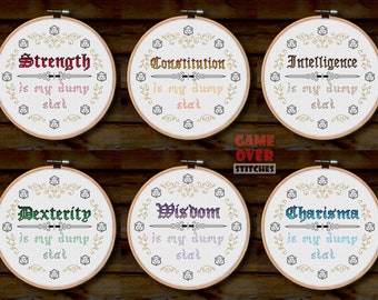 May include: Six embroidery hoops with white fabric and gold embroidery designs. Each hoop features a different Dungeons and Dragons stat: Strength, Constitution, Intelligence, Dexterity, Wisdom, and Charisma. The text reads "is my dump stat" for each stat. The hoops are arranged in two rows of three, with the text "GAME OVER STITCHES" in the center.