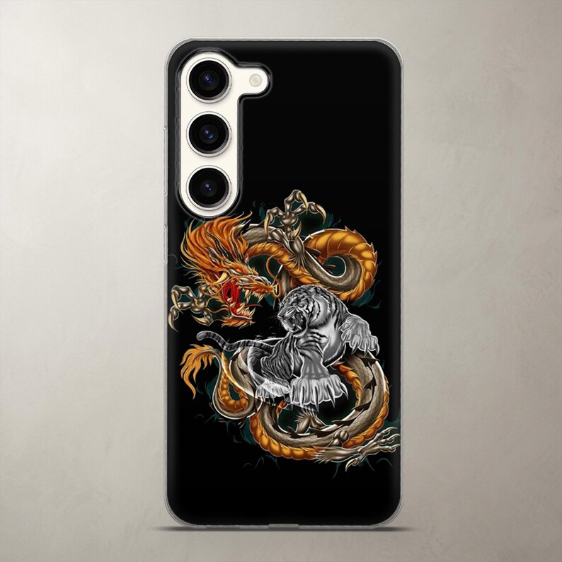 Intense wildlife and fantasy phone case featuring a fierce mythical battle between a white tiger and a dragon, shown on a Samsung Galaxy. Perfect aesthetic gift for dark art lovers. Accurately scaled to fit the heavy camera layouts of the newest models while keeping the highly detailed epic illustration intact