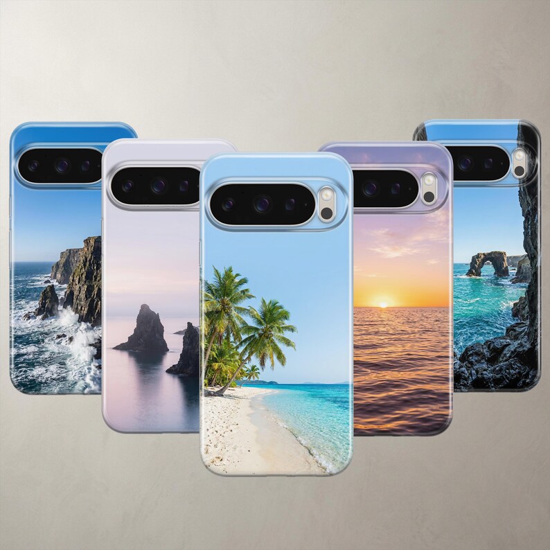 A product collage displaying five photorealistic nature phone cases for Apple iPhone and Google Pixel models. The designs feature breathtaking high-definition coastal photography, including dramatic ocean cliffs, mystic sea rocks, a vibrant tropical beach, a golden ocean sunset, and a coastal stone arch, all set against perfectly clean, clear blue skies.