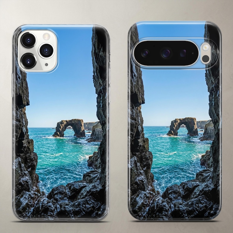 Breathtaking landscape phone case featuring a dramatic stone arch in the sea, surrounded by deep blue ocean water and a clear, pristine sky.