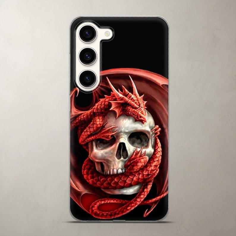 Epic fantasy phone case featuring a red dragon tightly wrapped around a creepy human skull on a black background, pictured on a Samsung Galaxy. High-resolution prints capture the intense gothic vibe perfectly. Durable, impact-resistant clear TPU silicone ensures daily drop protection without hiding the lenses